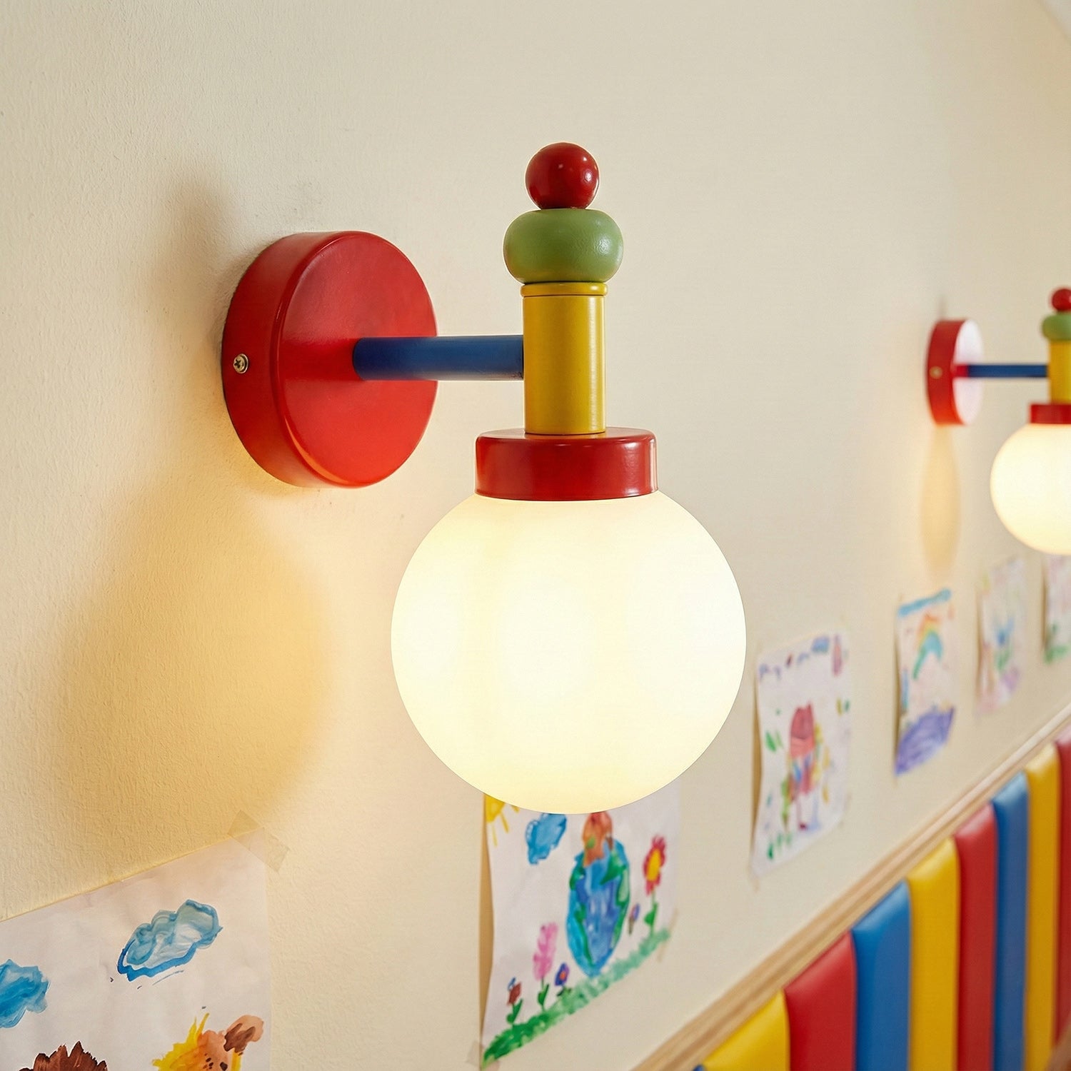 Junit Art Wall Lamp with an opal glass globe and red, blue, yellow and green hardware